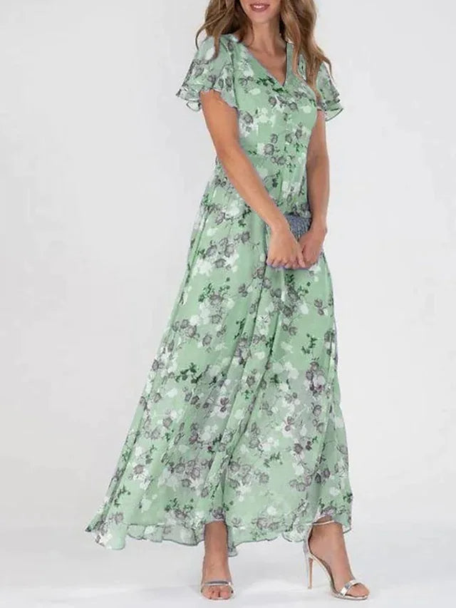 Stijlvolle dames maxi jurk met bloemenprint en A-lijn pasvorm. Comfortabele en elegante jurk voor diverse gelegenheden.