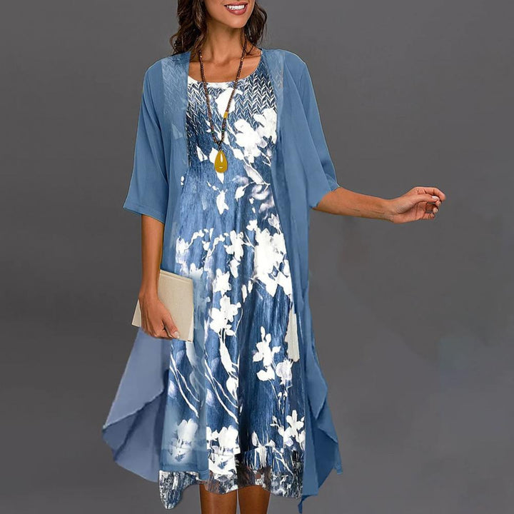 Comfortabele Théa zomerjurk voor dames met elastische taille, ronde hals en chique bloemenprint, ideaal voor de zomer.
