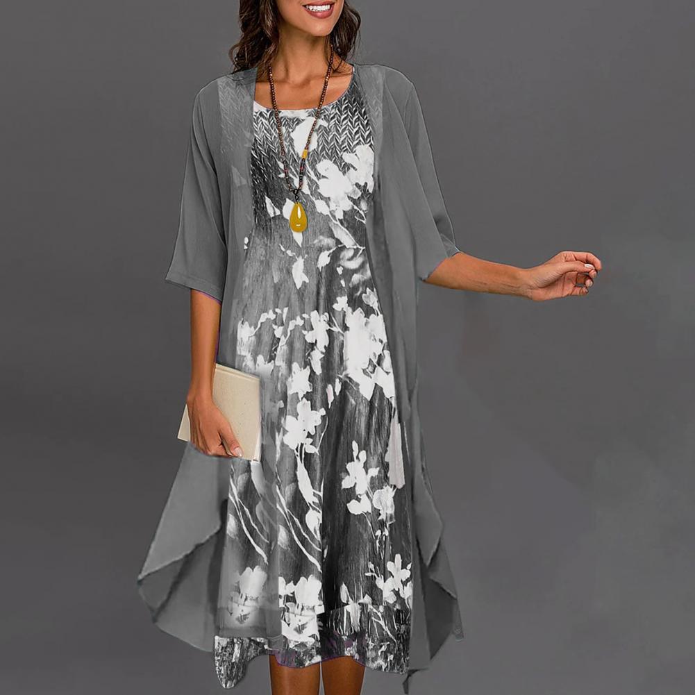 Tweedelige dames zomerkleding set: jurk met bloemenprint & bijpassend vest. Perfect voor elegante én casual zomerstijlen.