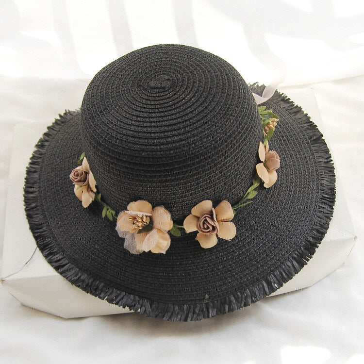 Comfortabele dames strandhoed met bloemenprint. Ideaal voor zonbescherming op vakantie.