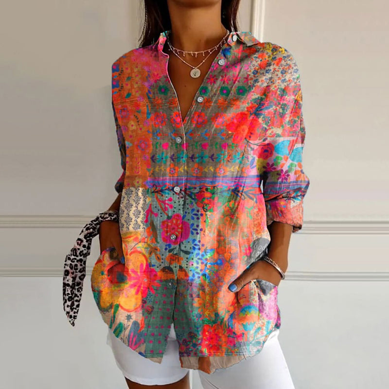 Elegante damesblouse met roze bloemenprint en lange mouwen, voor een chique en modieuze look.