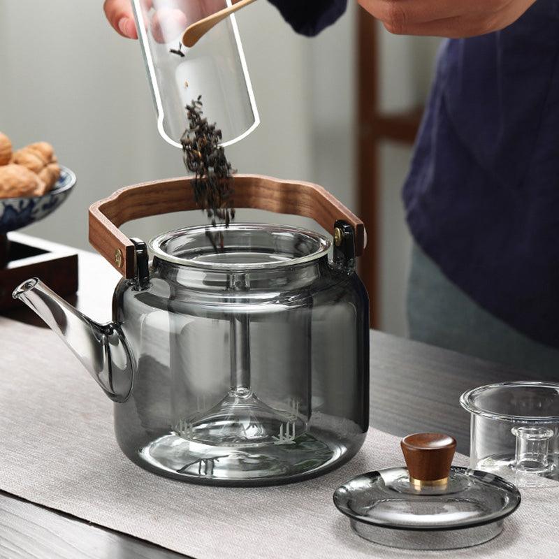 Elegante Grijzen theepot van hout en glas, ideaal voor het theeritueel, met transparant rookglas en een natuurlijke houten accent.