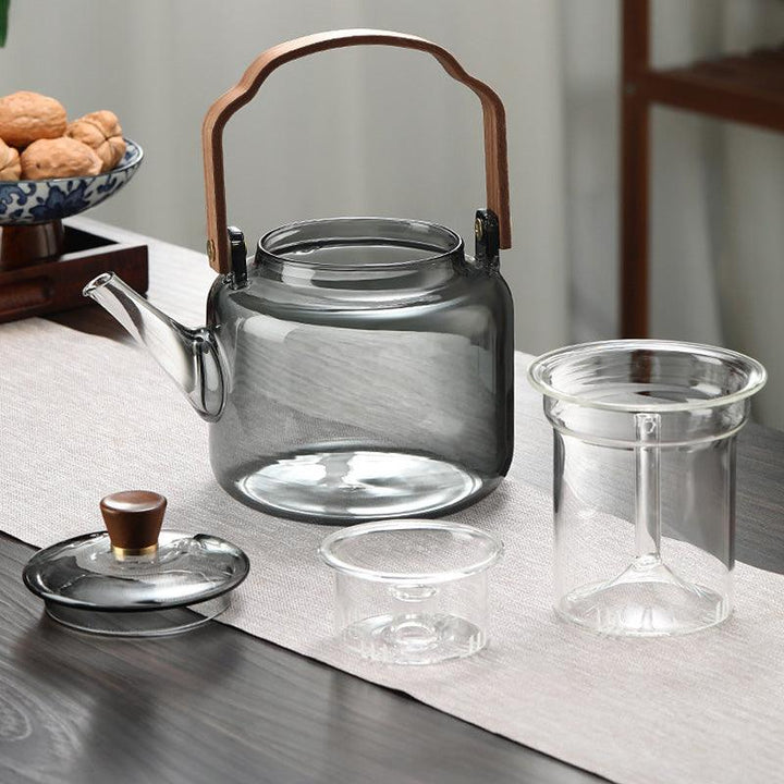 Elegante Grijzen theepot van hout en glas, ideaal voor het theeritueel, met transparant rookglas en een natuurlijke houten accent.