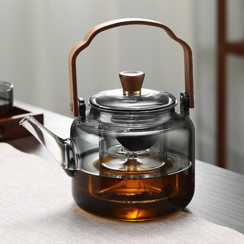 Elegante Grijzen theepot van hout en glas, ideaal voor het theeritueel, met transparant rookglas en een natuurlijke houten accent.
