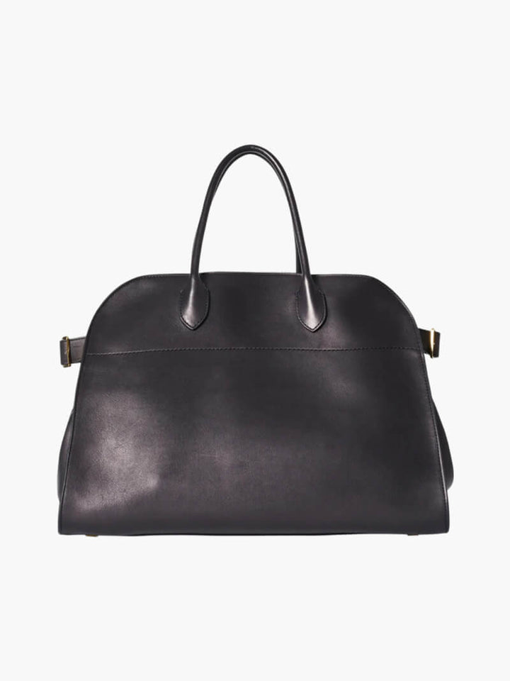 Elegante grote tas van veganistisch leer in zacht beige, ruim en stijlvol voor veelzijdig gebruik.