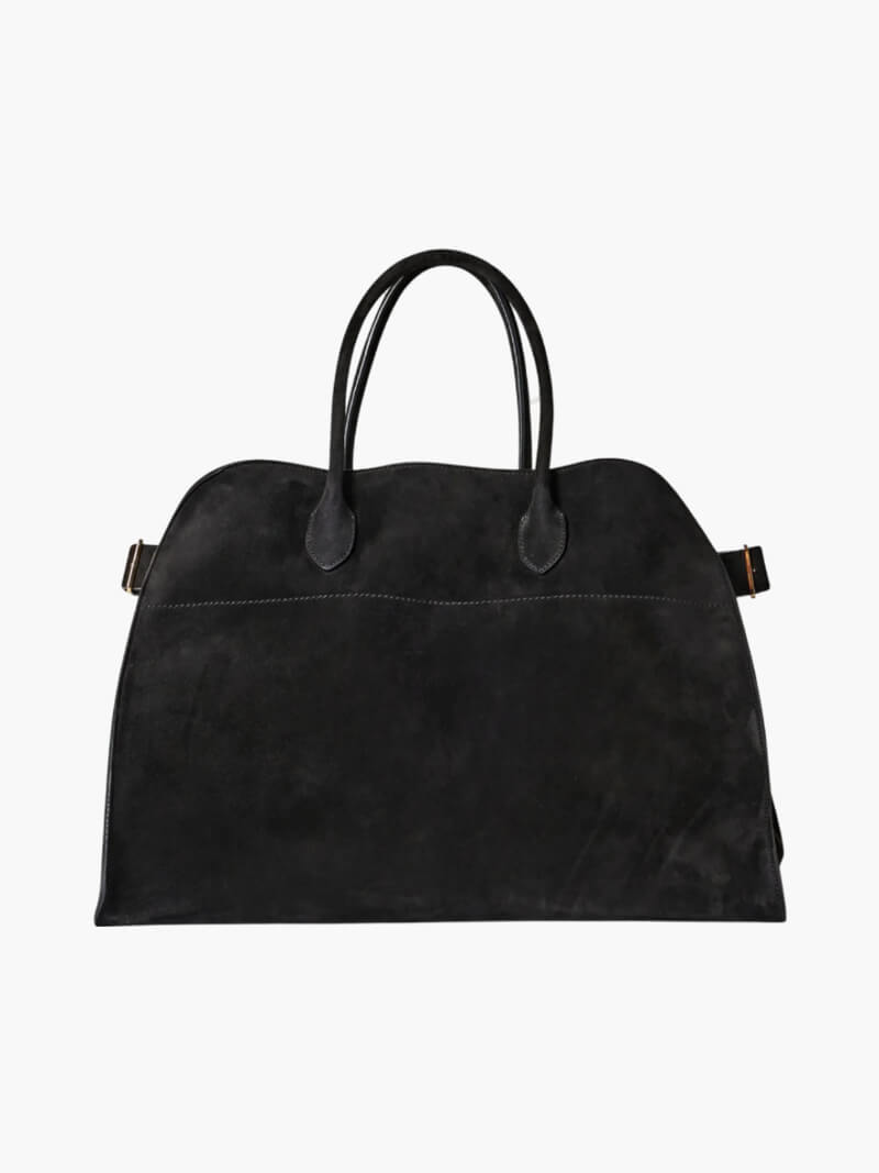 Elegante grote tas van veganistisch leer in zacht beige, ruim en stijlvol voor veelzijdig gebruik.