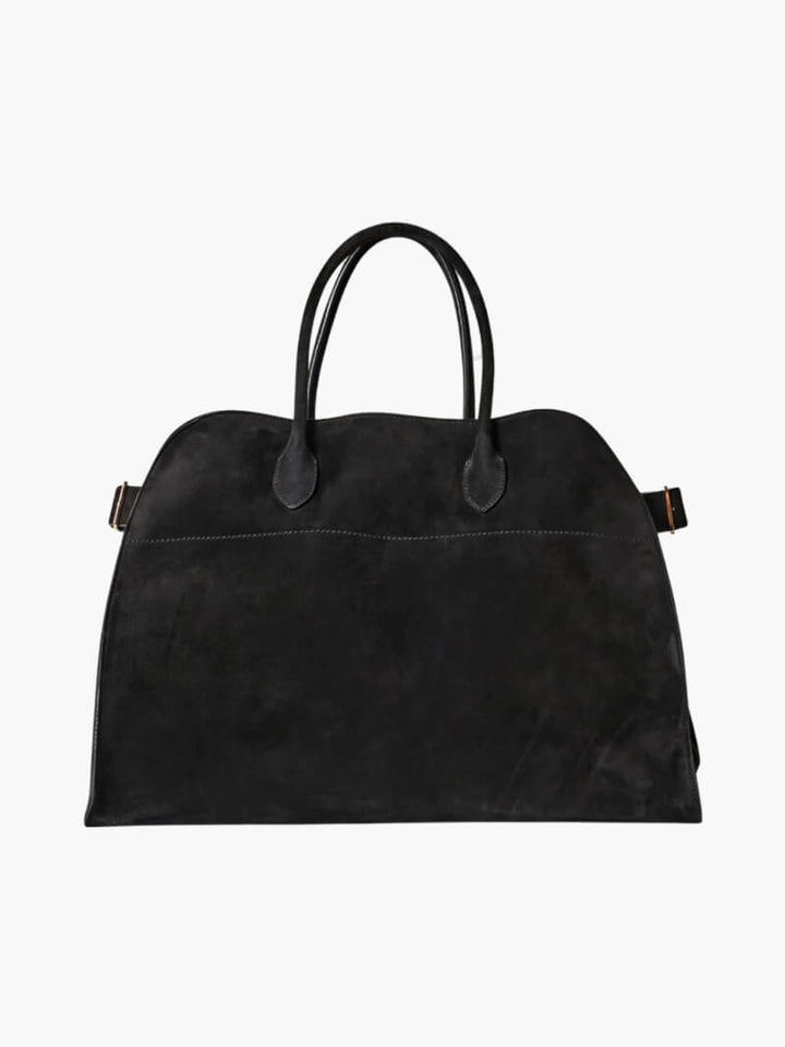 Elegante grote tas van veganistisch leer in zacht beige, ruim en stijlvol voor veelzijdig gebruik.