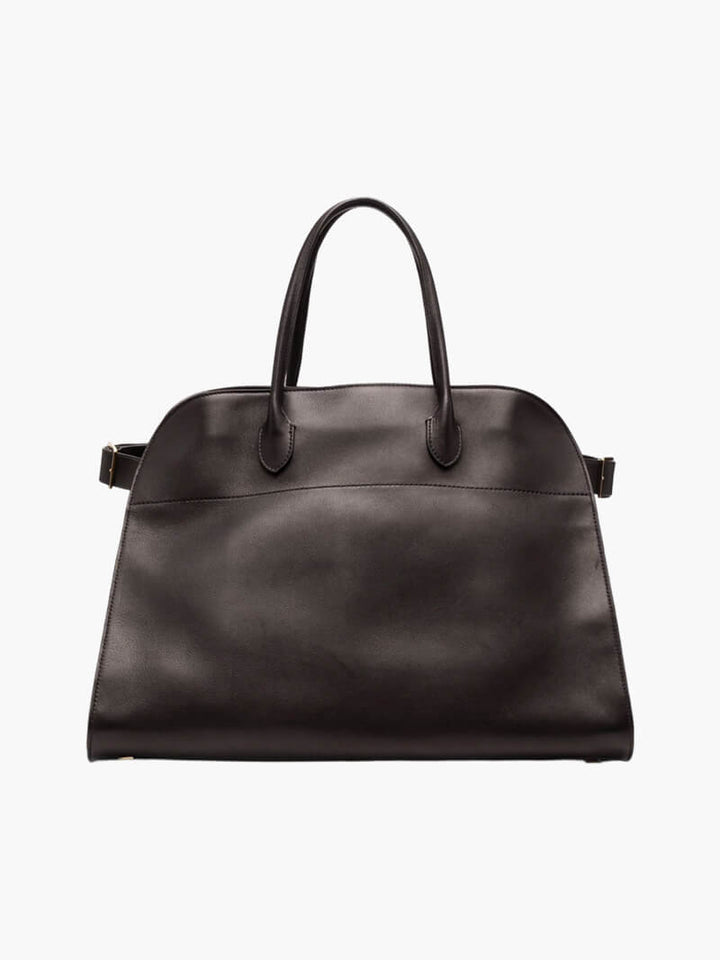 Elegante grote tas van veganistisch leer in zacht beige, ruim en stijlvol voor veelzijdig gebruik.