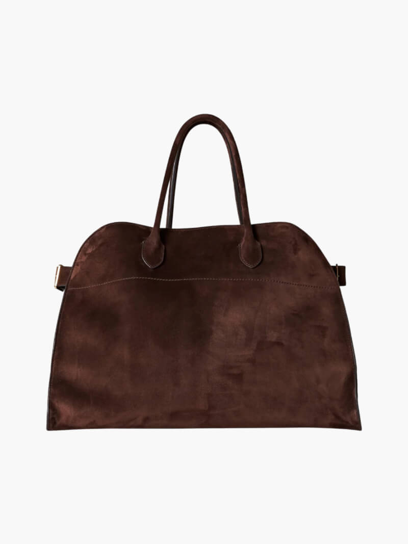 Elegante grote tas van veganistisch leer in zacht beige, ruim en stijlvol voor veelzijdig gebruik.