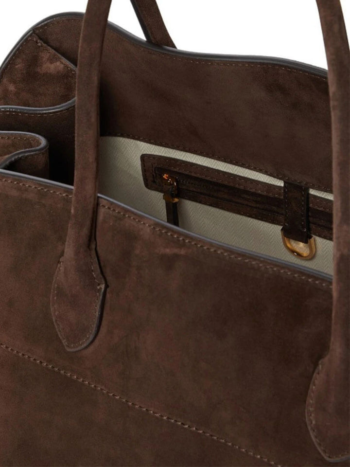 Elegante grote tas van veganistisch leer in zacht beige, ruim en stijlvol voor veelzijdig gebruik.