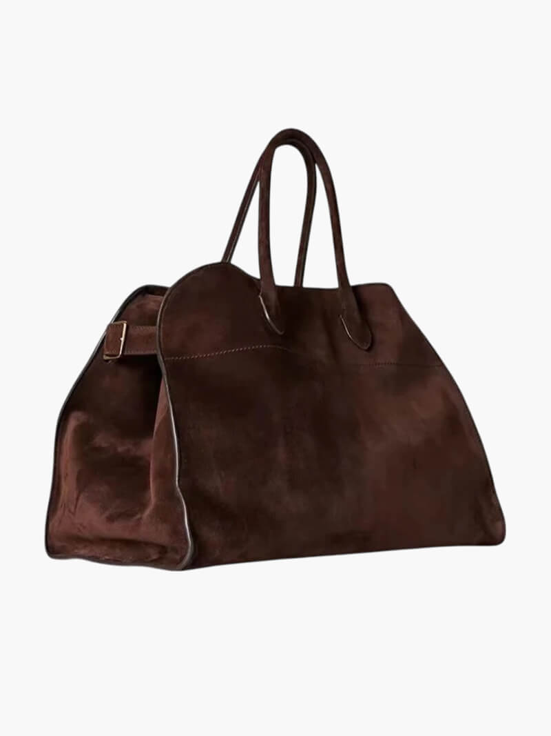 Elegante grote tas van veganistisch leer in zacht beige, ruim en stijlvol voor veelzijdig gebruik.