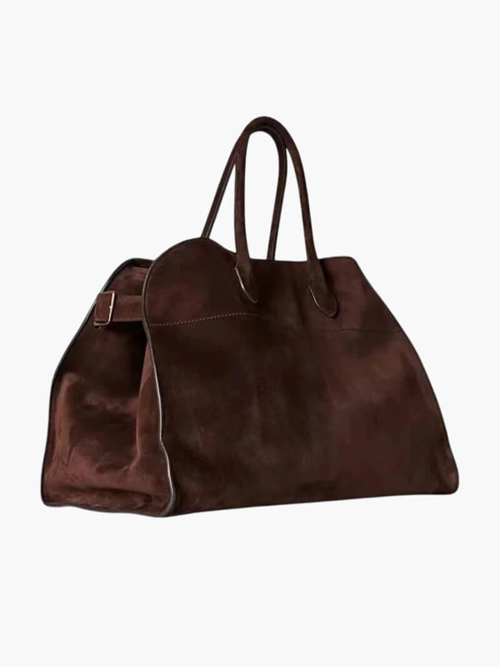 Elegante grote tas van veganistisch leer in zacht beige, ruim en stijlvol voor veelzijdig gebruik.