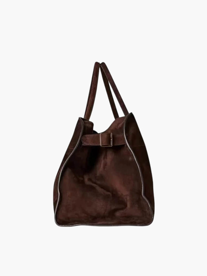 Elegante grote tas van veganistisch leer in zacht beige, ruim en stijlvol voor veelzijdig gebruik.