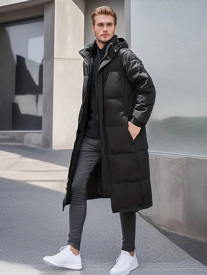Elegante lange gewatteerde winterjas voor heren met gewatteerd design en optimale weerbescherming voor koude dagen.