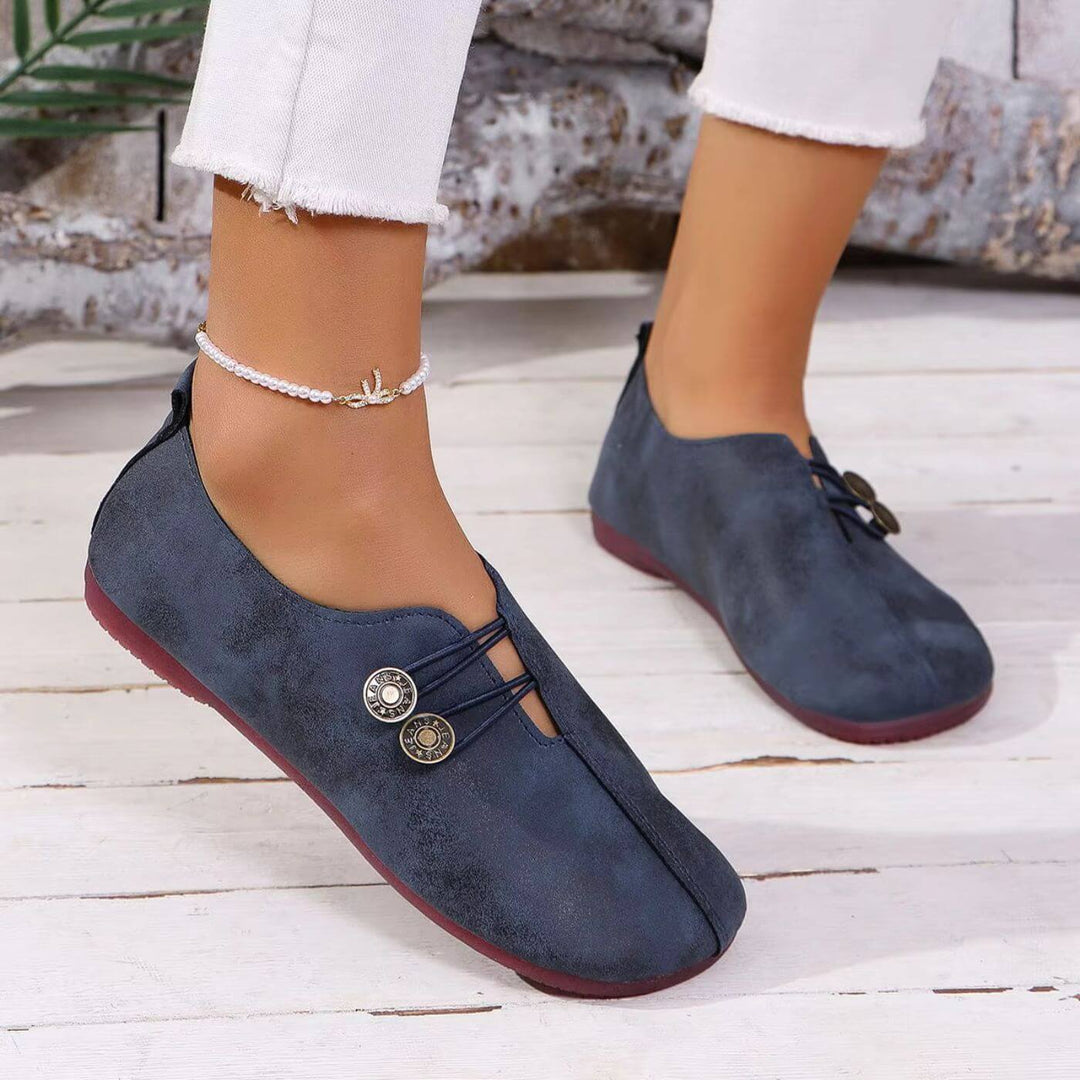 Zijaanzicht van elegante orthopedische schoenen in marineblauw met subtiele details.