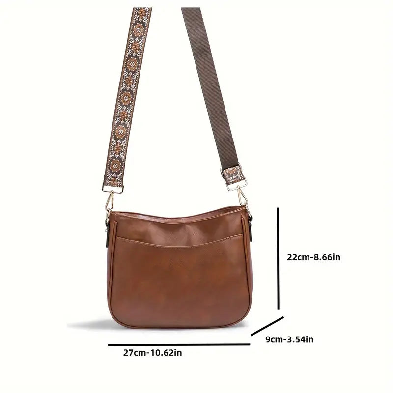 Elegante Quirina schoudertas in bohemien stijl met verstelbare riem en gouden details, vooraanzicht