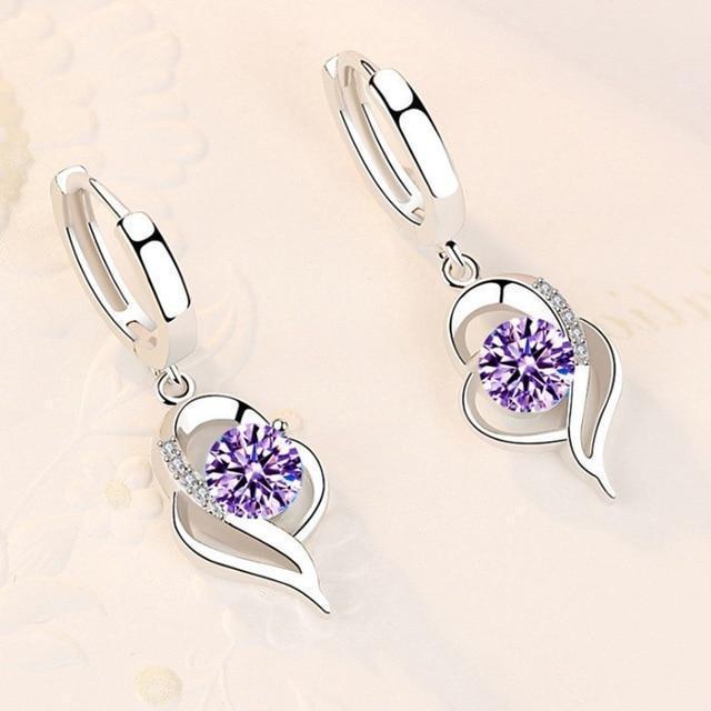 Sprankelende zilveren oorbellen met zirkonia bloemen, een verfijnd cadeau voor dames.