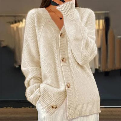Elegante damescardigan van zacht breiwerk met knoopsluiting, beige kleur, ideaal voor kantoor en vrije tijd.