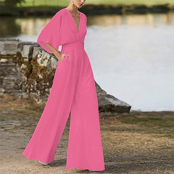 Elegant damesjumpsuit met V-hals, dolmanmouwen, elastische tailleband en wijde pijpen in zwart en bordeauxrood.