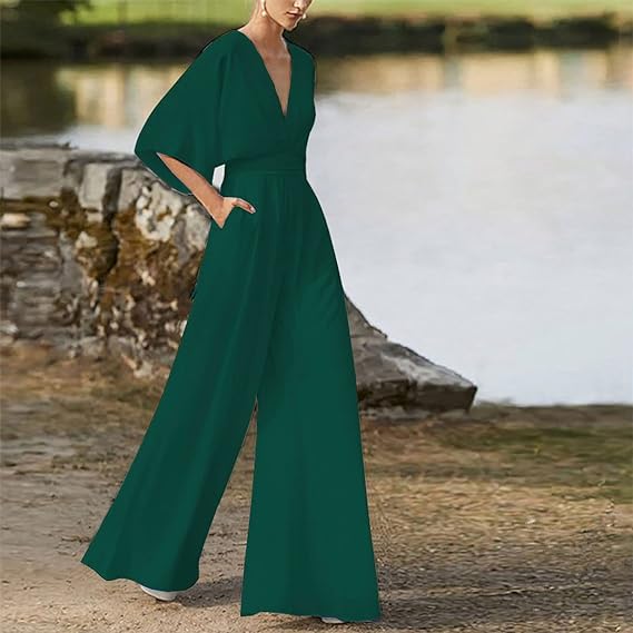 Elegant damesjumpsuit met V-hals, dolmanmouwen, elastische tailleband en wijde pijpen in zwart en bordeauxrood.