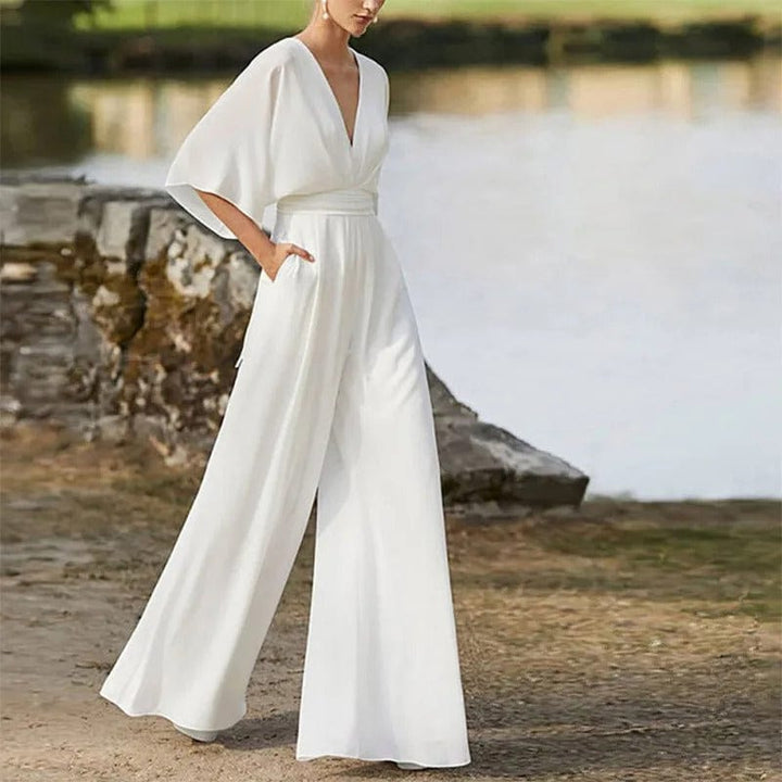 "Eleganter Damen-Jumpsuit mit V-Ausschnitt, Dolman-Ärmeln, elastischem Bund und weiten Hosen in Schwarz und Weinrot."