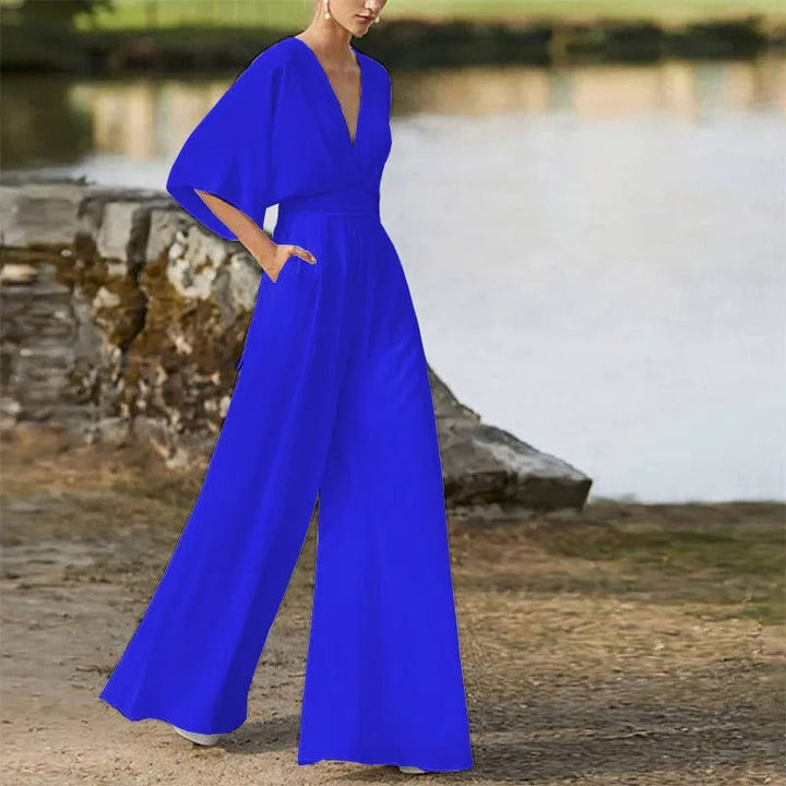 "Eleganter Damen-Jumpsuit mit V-Ausschnitt, Dolman-Ärmeln, elastischem Bund und weiten Hosen in Schwarz und Weinrot."
