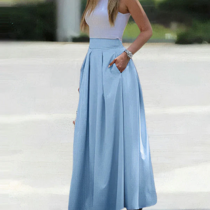 Elegante geplooide maxi-rok voor dames, vloeibaar, licht en met A-lijn, veelzijdig te combineren, ideaal voor chique gelegenheden.