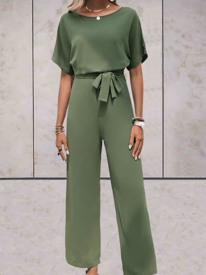 Elegant dames jumpsuit in beige, met zwarte details, benadrukt het silhouet, veelzijdig voor dag en avond, verkrijgbaar in XS-2XL.