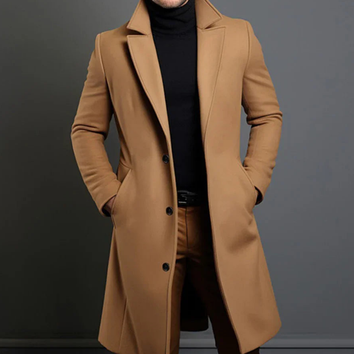 Elegante lange heren trenchcoat in donkergrijs, perfect voor de winter, met een klassieke snit en warmte-isolerende voering.