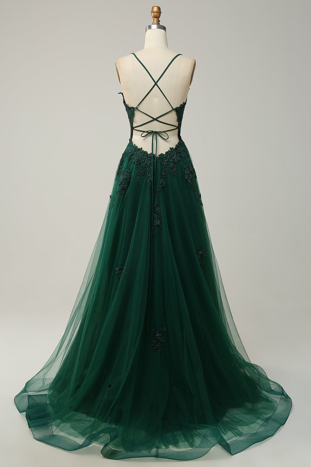 Elegante A-lijn galajurk met spaghettibandjes in donkergroen, perfecte keuze voor feestelijke gelegenheden en bruiloften.