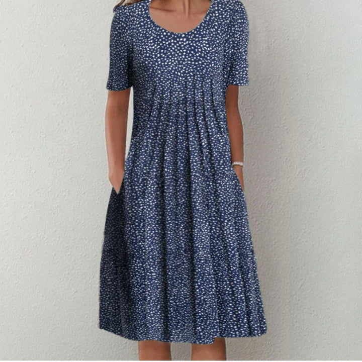 Elegante katoenen jurk met een verfijnde pasvorm en stijlvolle details, perfect voor formele en casual gelegenheden.