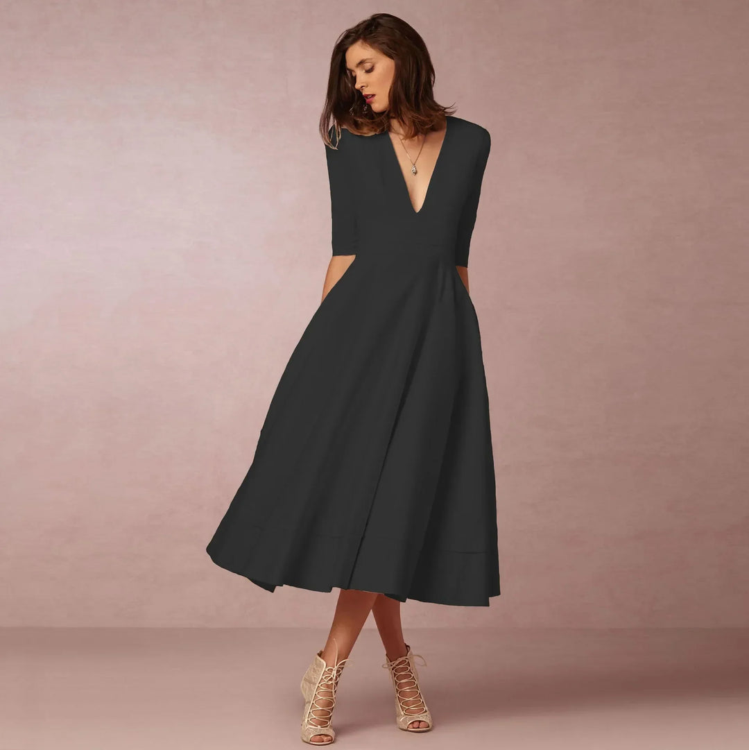 Elegante dames midi-avondjurk, klassiek silhouet, luxueuze stof, perfect voor formele gelegenheden.
