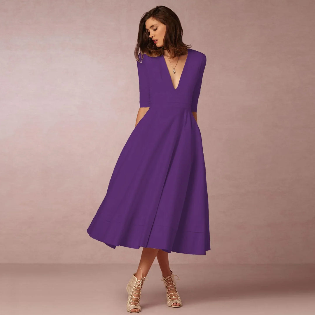 Elegante dames midi-avondjurk, klassiek silhouet, luxueuze stof, perfect voor formele gelegenheden.