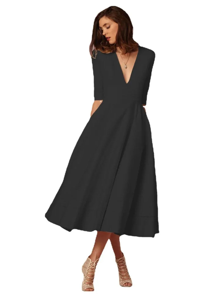 Elegante dames midi-avondjurk, klassiek silhouet, luxueuze stof, perfect voor formele gelegenheden.
