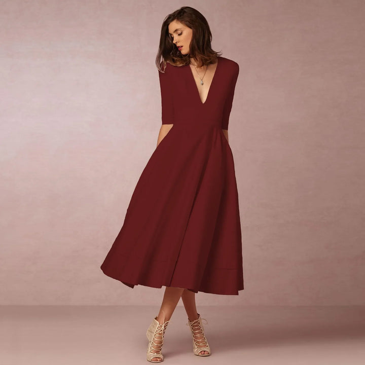Elegante dames midi-avondjurk, klassiek silhouet, luxueuze stof, perfect voor formele gelegenheden.
