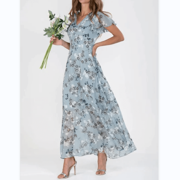 Elegant bloemen maxijurk voor dames, vloeiend met romantische patronen; ideaal voor bruiloftsgasten en zomerse evenementen.