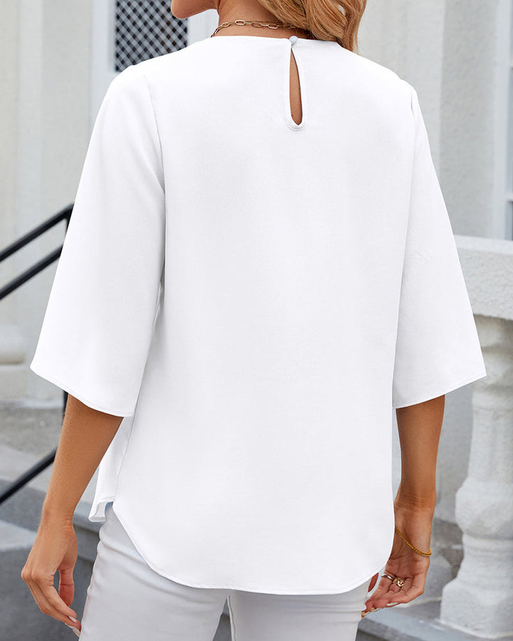 Elegant dames top met halflange mouwen, V-hals, losse pasvorm, geschikt voor werk en vrije tijd in een stijlvol design.