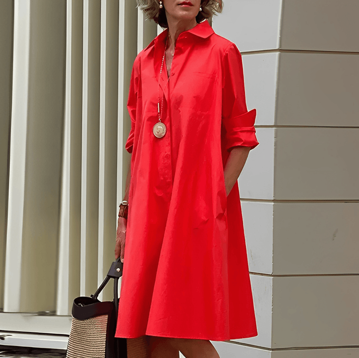 Elegante dames blousejurk met opstaande kraag en driekwart mouwen, perfect voor een stijlvolle look.