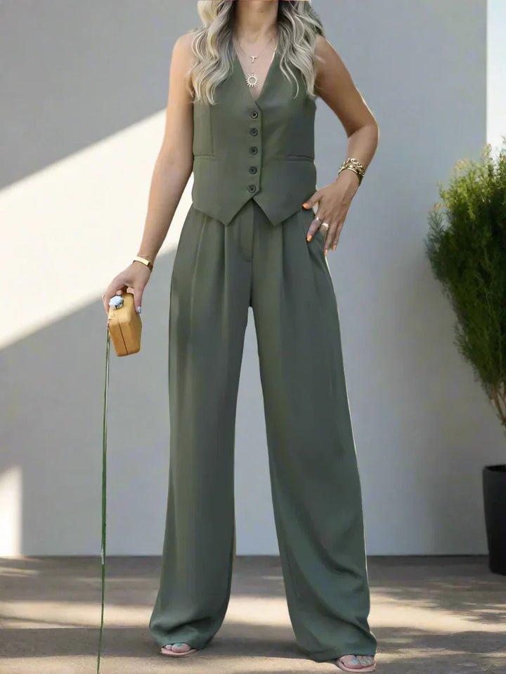 Elegant dames pantalonpak set met V-hals, wijde pijpen en vrouwelijke details, ideaal voor kantoor en feestelijke gelegenheden.