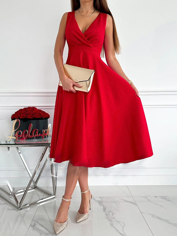 Midi-jurk voor dames met V-hals in abrikoos, mouwloos en elegant voor feestelijke gelegenheden.