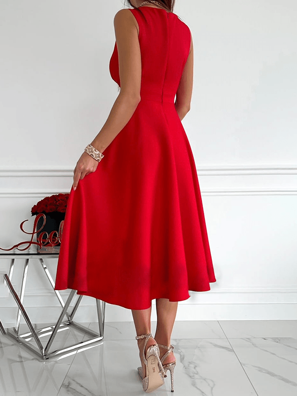 Midi-jurk voor dames met V-hals in abrikoos, mouwloos en elegant voor feestelijke gelegenheden.