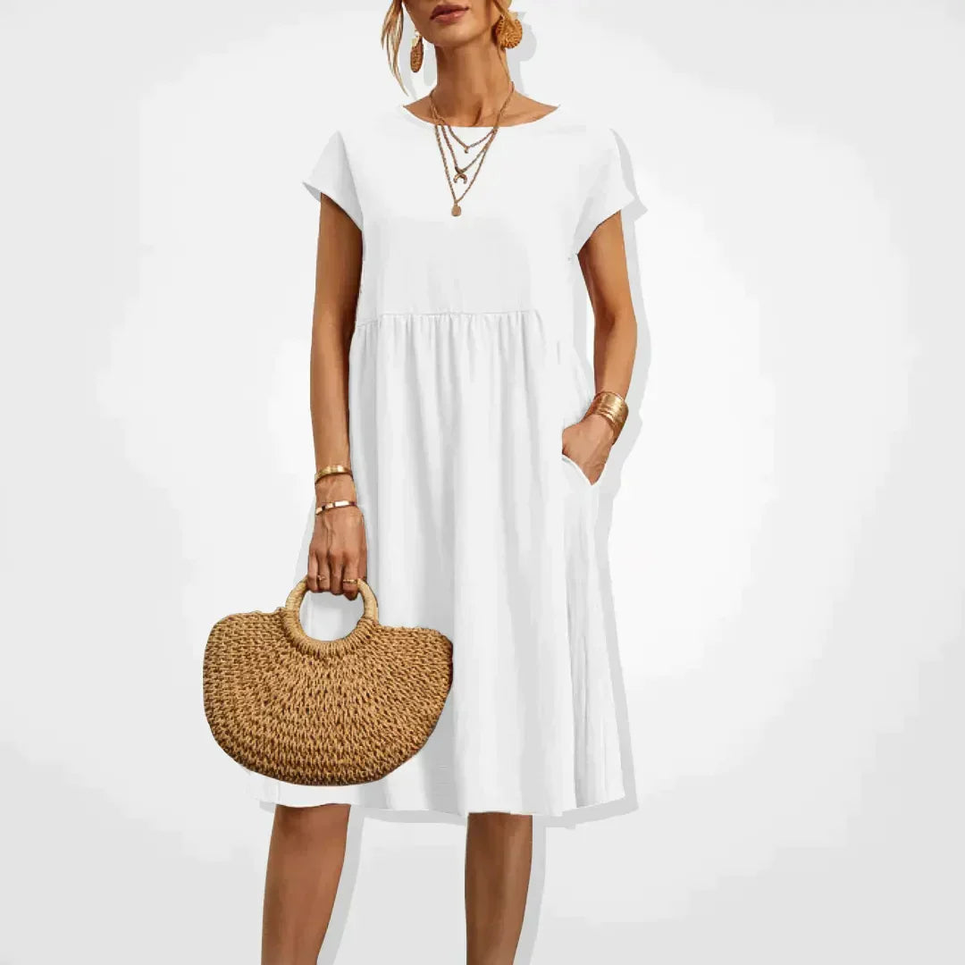 Elegant zomerjurkje voor dames met empire-silhouet, korte mouwen en een luchtige rok, ideaal voor warme dagen en veelzijdig in stijl.