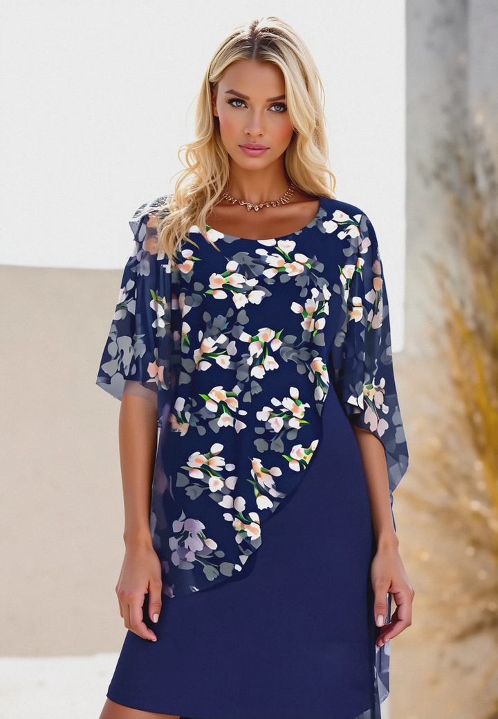 Elegant bloemen chiffon damesjurk met ronde hals, vrouwelijk bloemenpatroon, delicate stof, geschikt voor elke gelegenheid.