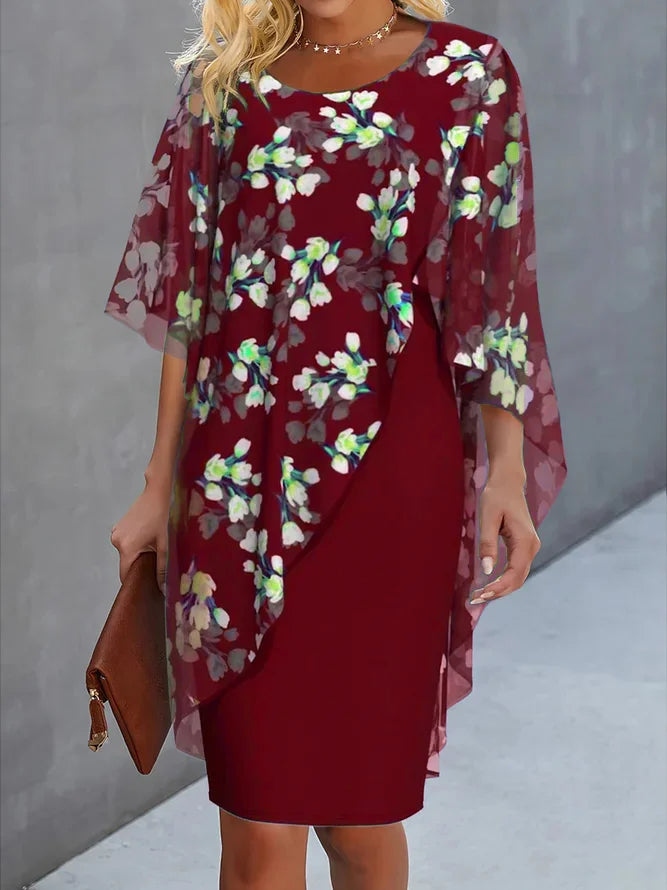 Elegant bloemen chiffon damesjurk met ronde hals, vrouwelijk bloemenpatroon, delicate stof, geschikt voor elke gelegenheid.