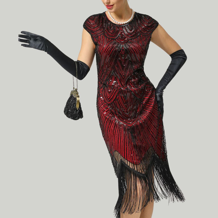 Elegante glitterjurk in Gatsby-stijl met sprankelende pailletten en franjes, nauwsluitend, in bordeauxrood, goud en andere kleuren.