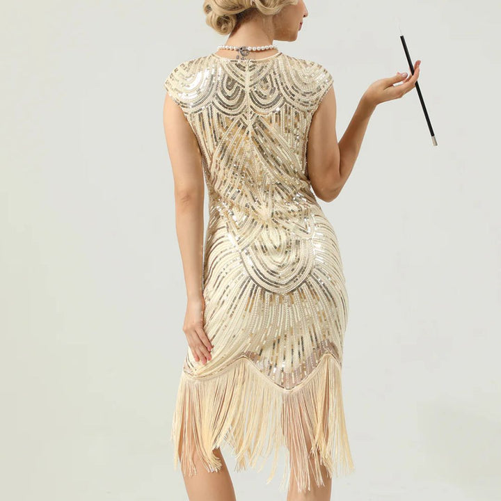 Elegante glitterjurk in Gatsby-stijl met sprankelende pailletten en franjes, nauwsluitend, in bordeauxrood, goud en andere kleuren.