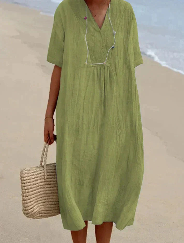Elegante lichtblauwe zomerjurk van katoen-linnen, V-hals, A-lijn, met strandtas, perfecte zomerse elegantie.