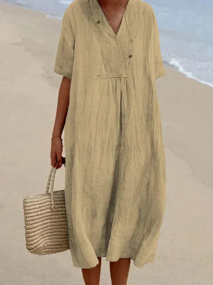 Elegante lichtblauwe zomerjurk van katoen-linnen, V-hals, A-lijn, met strandtas, perfecte zomerse elegantie.