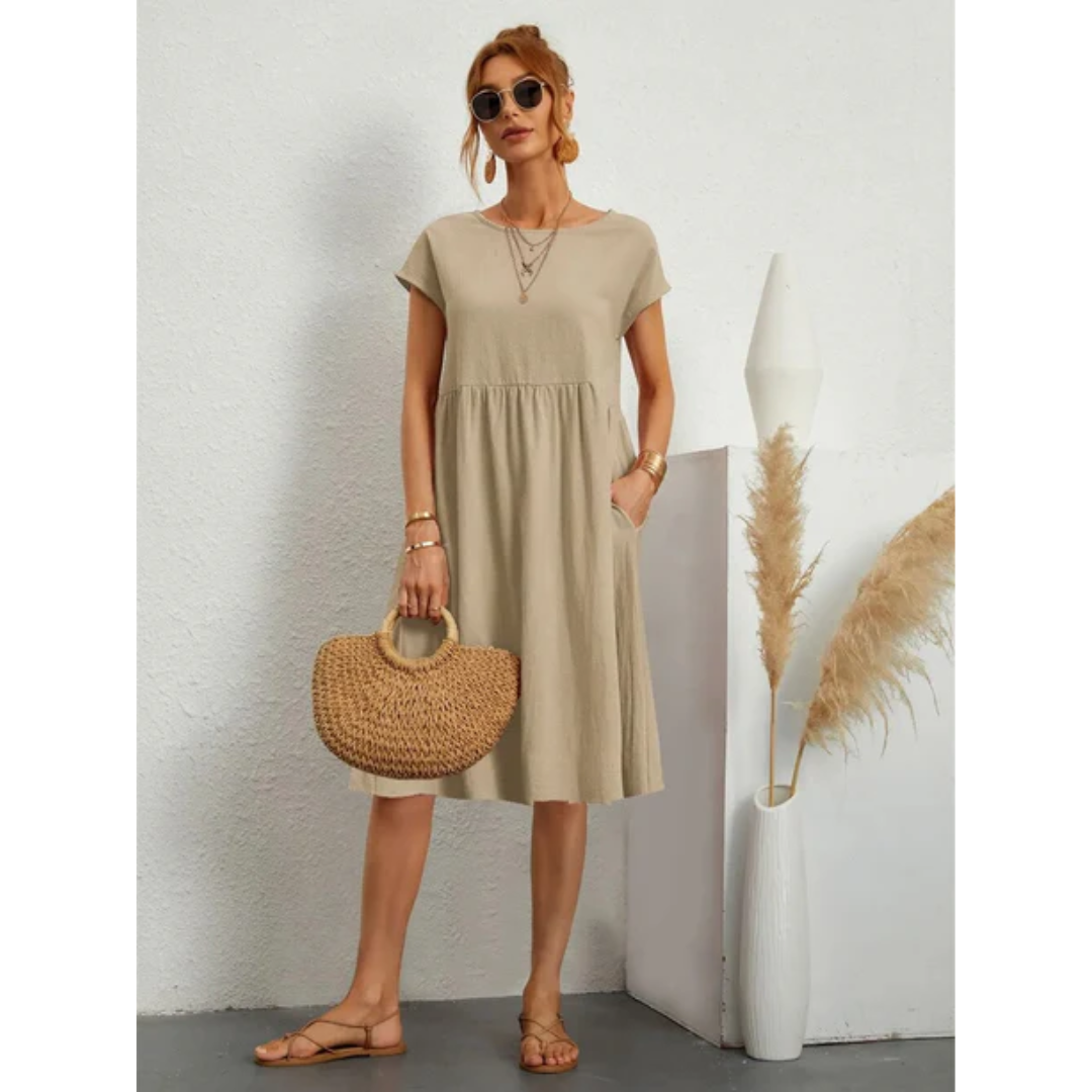 Elegante kortmouwige zomerjurk voor dames in midi-lengte, accentueert het figuur, ideaal voor formele en casual gelegenheden.