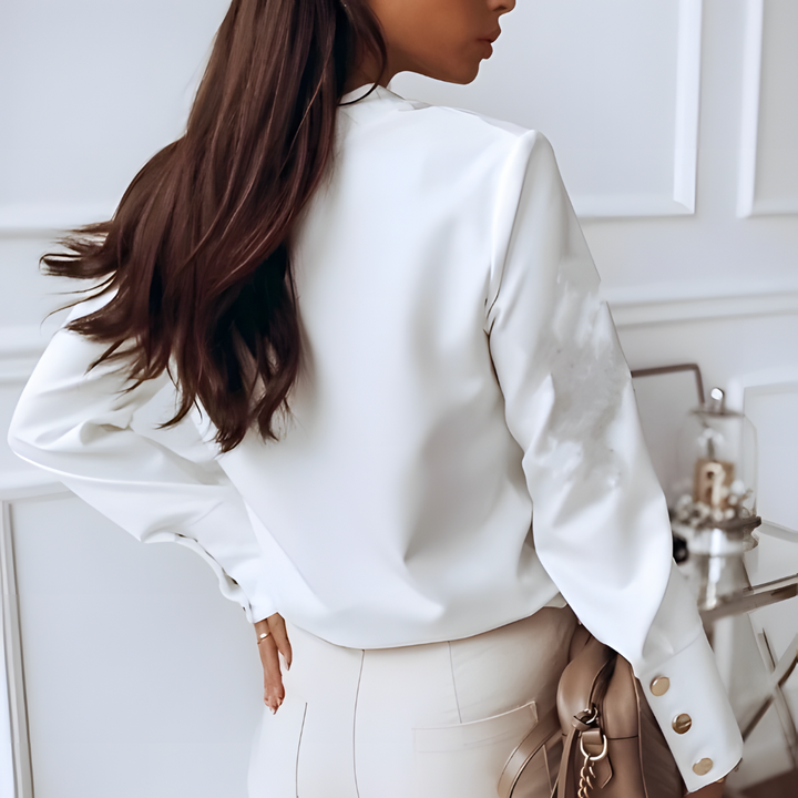Elegante damesblouse met lange mouwen en knoopsluiting, veelzijdig voor zakelijk en casual, gemaakt van hoogwaardige materialen.